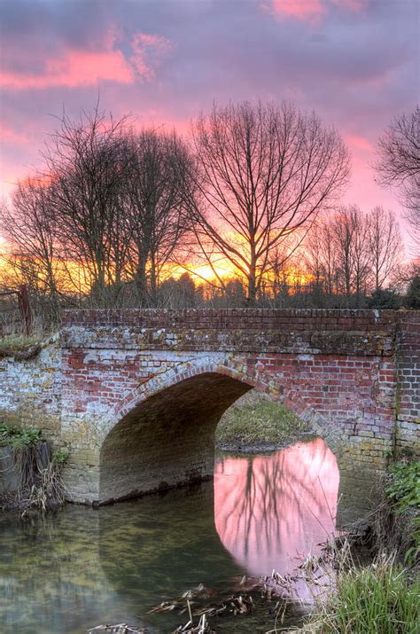 River Flowing Through An English Countryside Scene At Sunset Photograph By Fizzy Image