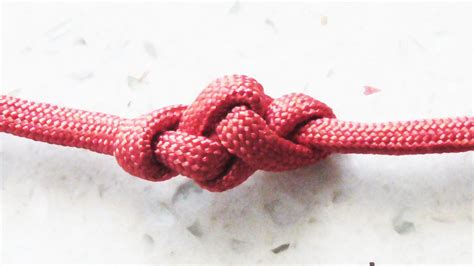 Thread the dangling free ends of the cord through the other buckle piece. How To Tie The Eternity Knot (With Paracord) | Paracord bracelet tutorial, Knots, Paracord