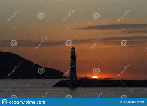 Seascape At Sunset Lighthouse On The Coast Seaside Town Of Turgutreis