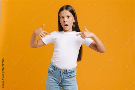 White Brunette Girl Expressing Surprise While Pointing Finger At Herself Adobe Stock