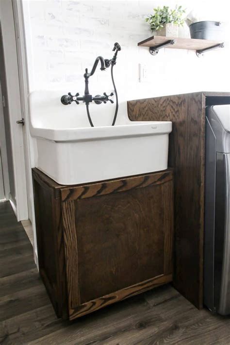The uniquely designed laundry/utility sink cabinet integrates seamlessly into many spaces, with its classic finishing look and durable components, offering ease of convenience, specifically for a laundry room, workshop, basement, or garage. DIY Farmhouse Sink Cabinet for Laundry Room - Making ...