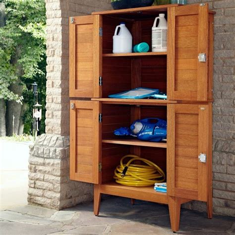 A Wooden Cabinet With Two Doors On The Front And One Door Open To Show
