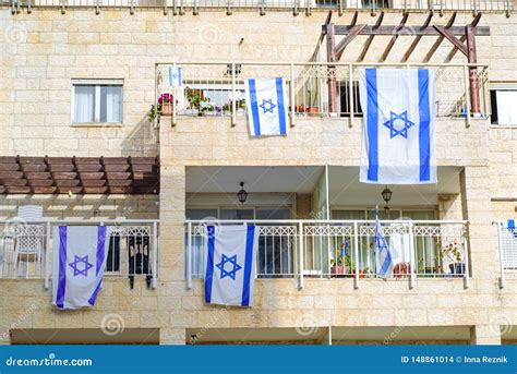 Front Side Of Typical Israeli House With Israel Flags On Window Stock