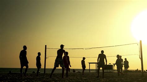 People Play Volleyball On Beach At Sunset Stock Footage Sbv 336850844