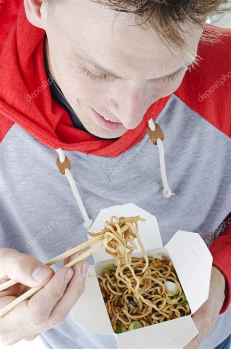 Man Eating Take Away Noodles Stock Photo By ©mactrunk 25433443