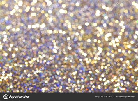 Abstract Colored Glitter Background With Shining Light And Soft Bokeh
