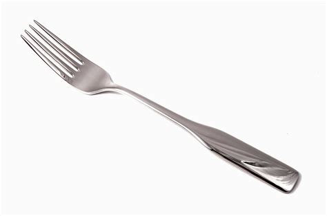 Stainless Steel Fork On White Background · Free Stock Photo