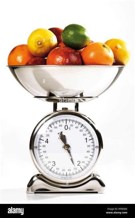 Citrus Fruit On A Kitchen Scale Stock Photo Alamy