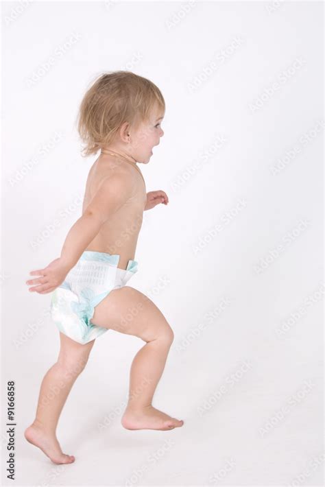 Babe Naked Girl In Diaper Is Running Stock Photo Adobe Stock