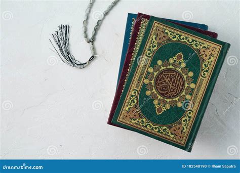 Holy Quran With Written Arabic Calligraphy Meaning Of Al Quran On White