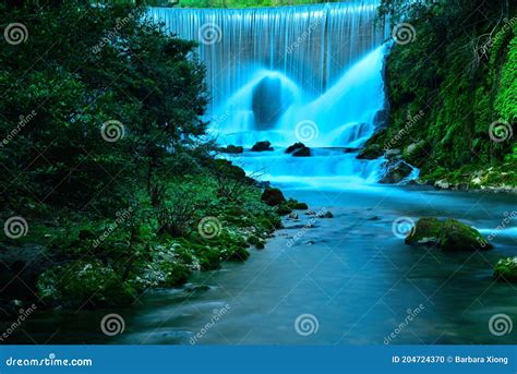 Beautiful Deep Forest Waterfall With Mountains And Trees Landscape