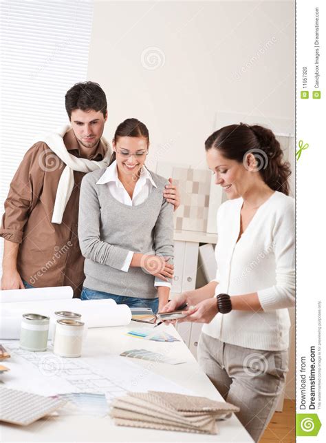 Female Interior Designer With Two Clients Stock Photo Image Of