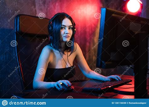 Beautiful Professional Gamer Girl Playing In First Person Shooter