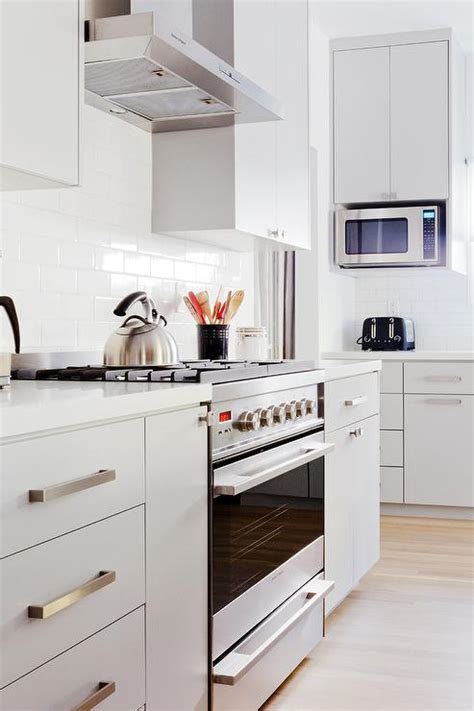 Cabinetry can transform how a kitchen looks and performs, which is why it should have quality components, regardless of budget size. Light Gray Flat Front Kitchen Cabinets - Modern - Kitchen ...