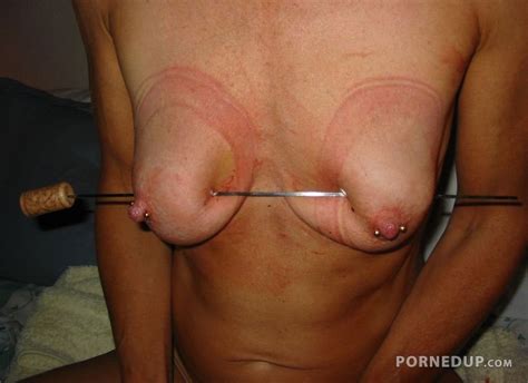 Metal Skewer Through Her Tits Porned Up