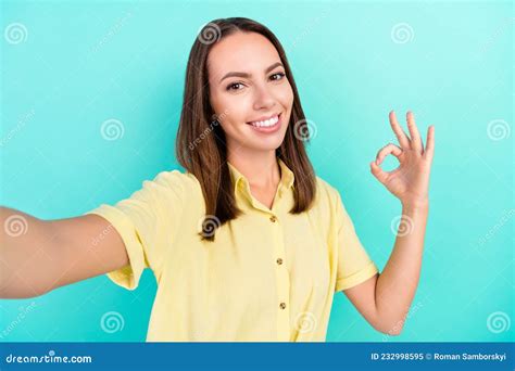 Photo Of Impressed Millennial Brunette Lady Do Selfie Show Okey Wear Yellow Top Isolated On Teal