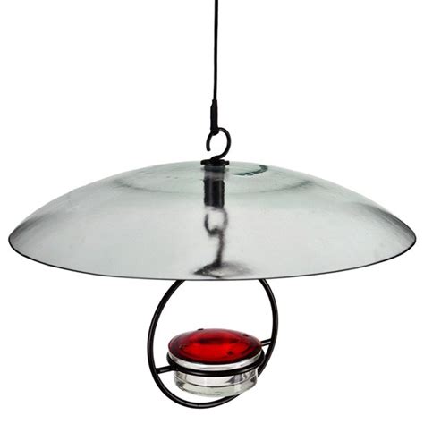 Songbird all weather bird feeder offers clean feeding as birds reach up into sheltered circular slots to feed. Recycled Glass Weather Dome