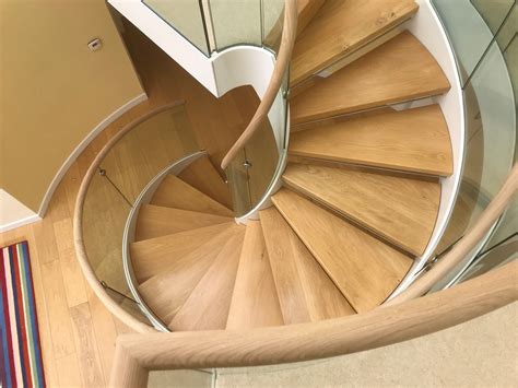 Sketches & profiles of stair handrail design requirements, safe and unsafe railings a comparison of building codes specifying hand railing. Spiral Stair Handrail Aberdeen | Haldane UK