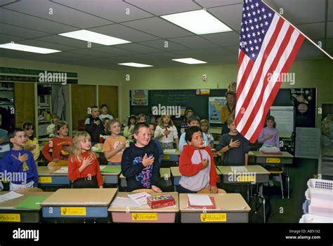 Third Grade Elementary School Class Recites The Pledge Of Allegiance