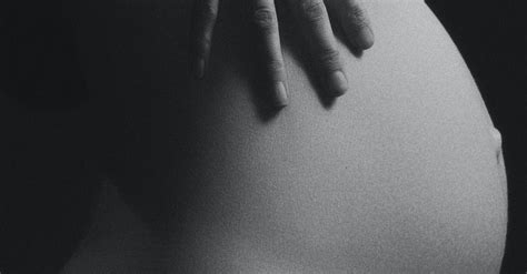 Grayscale Photo Of Pregnant Woman Holding Stomach · Free Stock Photo
