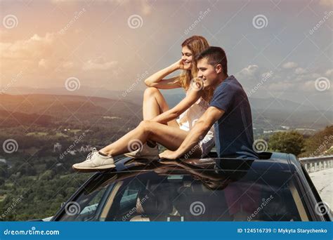 Young Couple On Road Trip Travel By Car Together And Enjoy The Nature