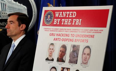 u s charges 7 russian intel officers for cybercrimes pbs newshour
