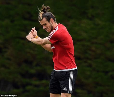 Madrid , always in that order. Gareth Bale dances with 'Wales. Golf. Madrid' banner ...