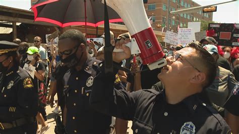 Officers March In Solidarity With Dallas Protesters In Police Planned Rally