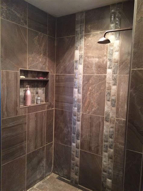 Cut the tiles using tile nippers or a tile saw. Open shower with extra large tile & vertical clear brick ...