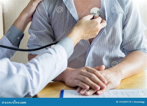 Doctor Checking Patient Stock Photos Download 25438 Royalty Free Photos