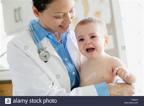 Doctor Examining Baby Stock Photo Alamy
