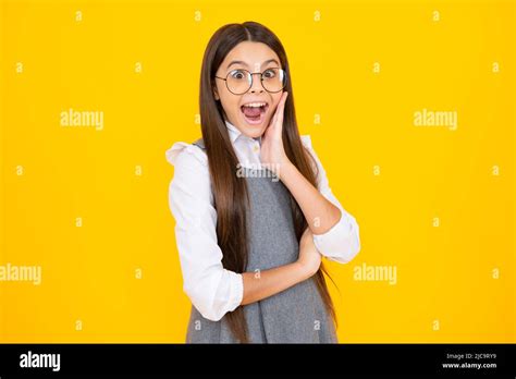 Shocked Teenager Child With Amazed Look On Yellow Background Amazement