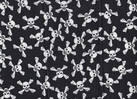 Skulls And Crossbones On Black Fabric