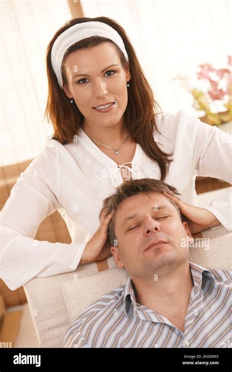 Attractive Woman Giving Head Massage To Man Stock Photo Alamy