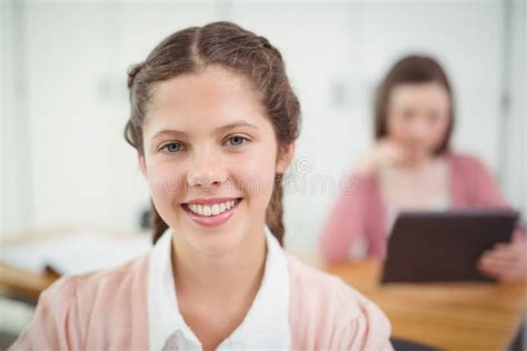 Smiling Schoolgirl Sitting In The Classroom Stock Image Image Of Connection Development 87392369