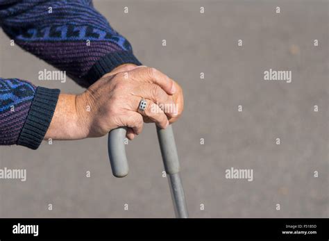 Hands Of Senior Man Resting On A Walking Stick Stock Photo Alamy