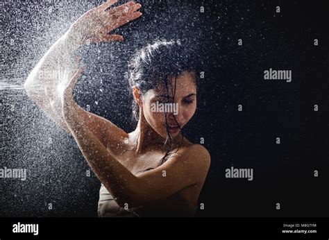 Young Girl Portrait And Splashing Water In Her Face Beautiful Female