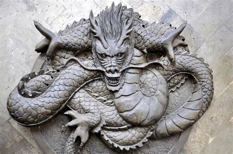 Cruise is a traditional wooden junk. Chengdu, China: Bas Relief Dragon. A handsome carved stone ...