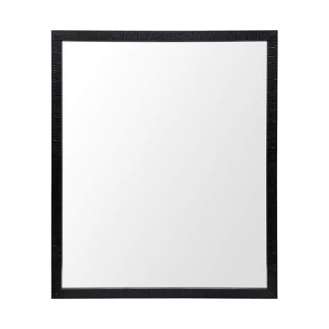 A Black Framed Mirror On A White Wall