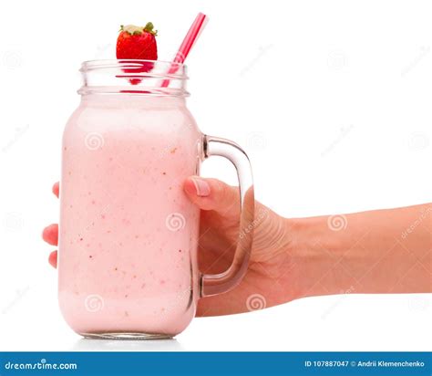 A Girl Is Holding A Jar With Strawberry Smoothies Decorated With A Strawberries Isolated Close