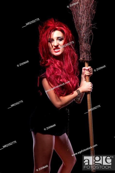 Evil Red Haired Witch And Her Broomstick Stock Photo Picture And