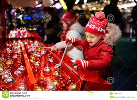 Kids At Christmas Fair Children Shopping Xmas Ts Stock Photo