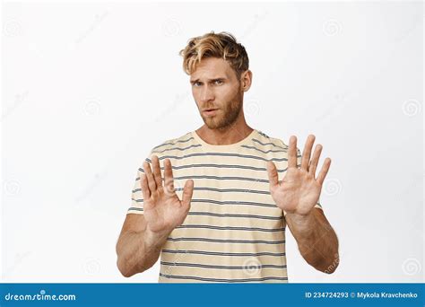 Image Of Reluctant Handsome Man Shaking Hands In Rejection Gesture Saying No Decline Offer