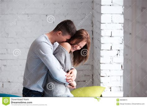 Beautiful Couple Having Great Time And Hugging At Home Stock Image