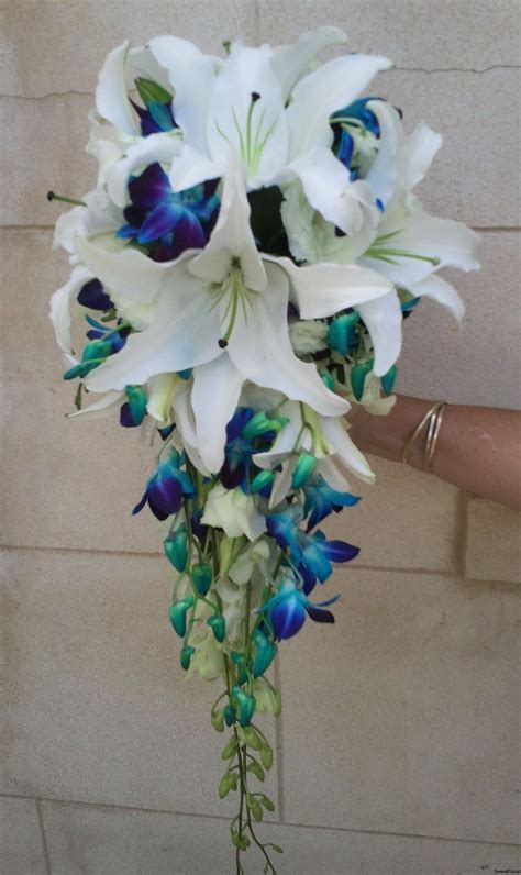 It has been finished off with some crystal detailing and some hot pink ribbon. Bouquet | Wedding flowers, Pink wedding flowers, Blue ...