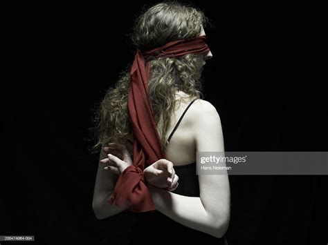 Young Woman Wearing Blindfold Arms Tied Behind Back Rear View Foto