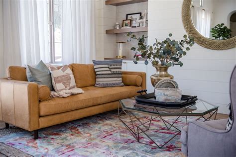 Looking for a comfortable new sofa? Living room with bold rug, bold accessories, ship lap and ...