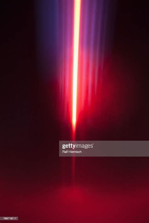 Closeup Of Abstract Red And Blue Light Trails Against Black Background
