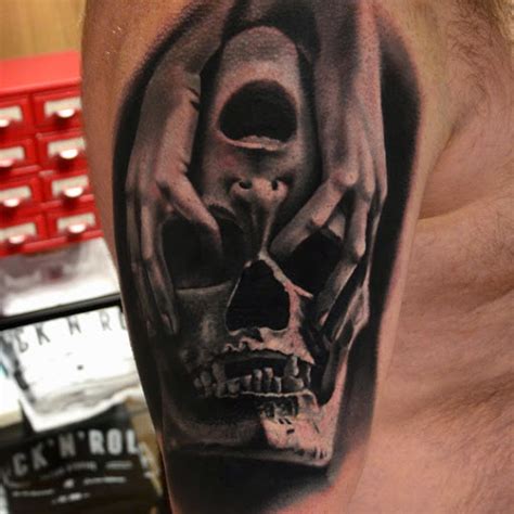 hand skull face tattoo entertainmentmesh