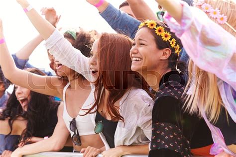 Cheering Young Friends In Audience Stock Image Colourbox